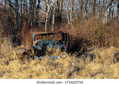 A Old Abandoned Car In A Farm Feild Near Saskatoon, Saskatachewan Canada