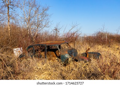 A Old Abandoned Car In A Farm Feild Near Saskatoon, Saskatachewan Canada