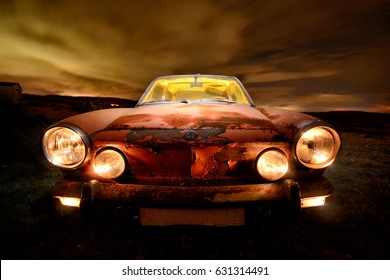 Old Abandoned Car At Night Light Painted With Several Flashlights