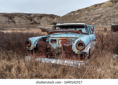 Old Abandoned Cars In The Badlands Of Alberta. 