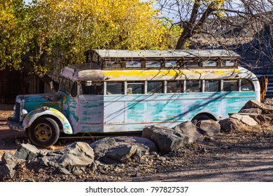 Old Abandoned Converted School Bus In Salvage Yard