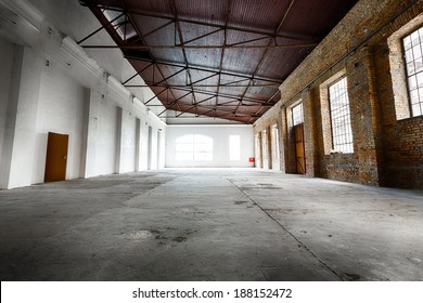 An Old Abandoned Empty Warehouse Interior