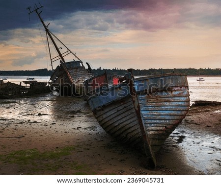 Old abandoned fishing boats at Pin Mill on the banks of the River Orwell on the Shotley peninsula near Ipswich on the Suffolk coastline