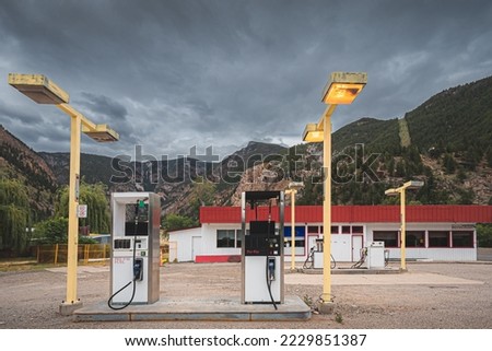 An old abandoned gas station rest stop in mining town Hedley, BC in the Okanagan against a dark moody sky.