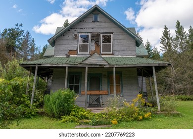 An Old Abandoned Home Sits Crumbling And Rotting Away In A Rural Area On St. Joseph Island In Ontario.