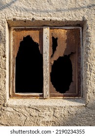 Old Abandoned House Window With Rusty Mesh