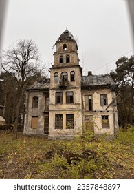 An old abandoned mansion with a tower. An atmosphere of desolation, devastation, depression. Life is gone