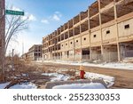 Old abandoned Packard factory manufacturing plant building in Detroit Michigan on a cold winter snow day	
