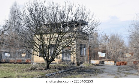 old abandoned premises, ruin. empty territories, abandoned houses. concept of war, Chernobyl disaster, apocalypse. brick buildings. sad view, heavy atmosphere. desolation and destruction of the abode - Shutterstock ID 2255460253
