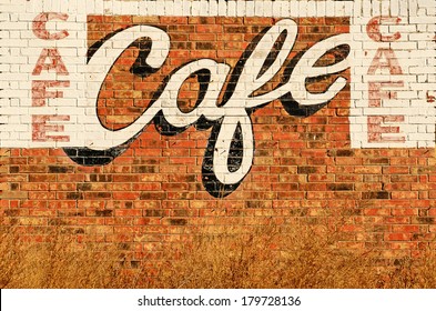 Old Abandoned Restaurant Or Cafe Sign Painted On A Wall Along Route 66 In Northern Texas