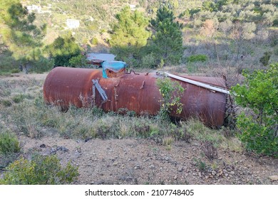 Old abandoned rusted water tank cistern