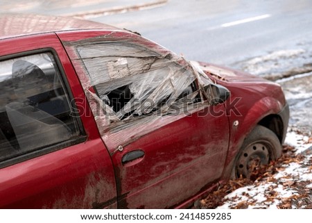 old abandoned rusty car smashed by looters on the street of a city in Ukraine Foto stock © 