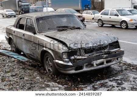 old abandoned rusty car smashed by looters on the street of a city in Ukraine Foto stock © 