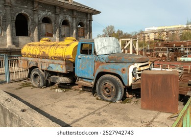 An old, abandoned, rusty truck with flat tires. Desolation and decay. - Powered by Shutterstock