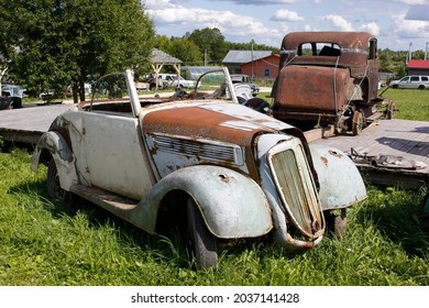 Old abandoned rusty vehicles, crushed cars in junkyard. Cars recycling concept. - Shutterstock ID 2037141428