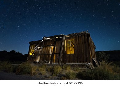 Old abandoned shack at night under a starry Nevada sky. - Powered by Shutterstock