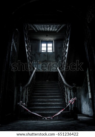 Old abandoned stairs going up to the another floor. Horror feels