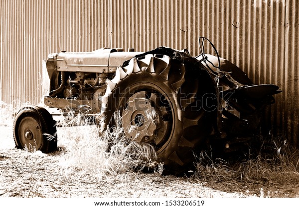 The old abandoned\
tractor in the farm 