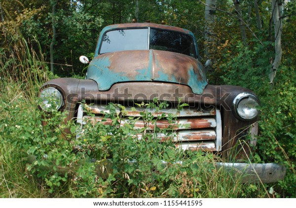 Old Abandoned Truck in the\
Woods
