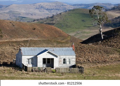 An Old Abandoned Weatherboard Farm House  In An Australian Rural Landscape