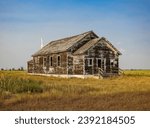 Old Abandoned and Weathered Wood Schoolhouse Out on the Western Frontier
