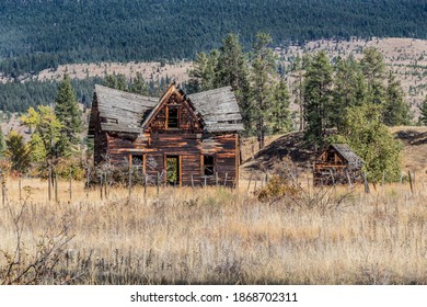 Old Abandoned Wooden Farm House In A Field In Western Canada