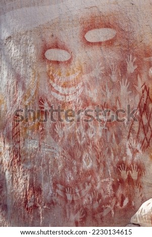 Old aboriginal rock art on a wall in Australia