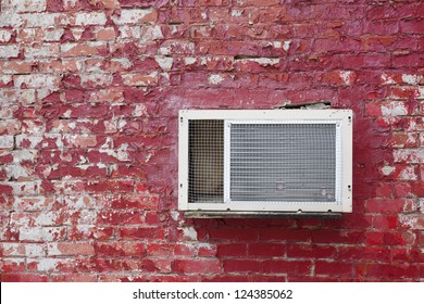 Old AC Unit On The Old Red Brick Wall.