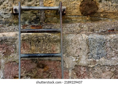 Old Access Ladder Bolted To A Harbour Wall