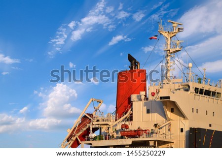 Old accommodation bridge deck of cargo ship and navigation with mast radio, radar for communication during ship moored in floating dry dock for maintenance under ship Repairing in shipyard.