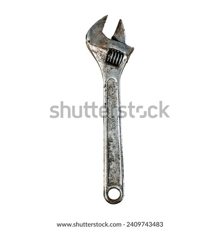 Old adjustable wrench on white background