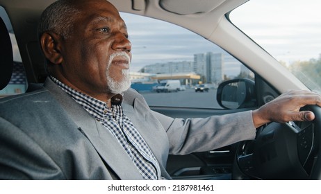 Old African American Man Driving Car Serious Pensive Elderly Male Leaves Parking Lot Mature Businessman Looking Closely At Road Drives Up Approaches Intersection Experienced Driver Ride On Highway