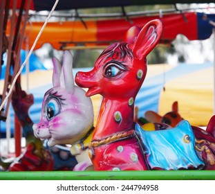 Old Aged Colorful Riding Animals Deer Horses Rabbits Ducks Toys In A Playground As Circus Carousel In A Country Fair In LOY KRATHONG Festival THAILAND. 