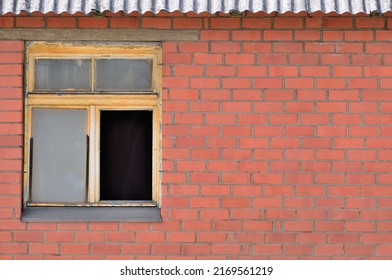 Old aged shed broken windows glass red bricks hut wall background grungy rusty dirty damaged wooden frame textured horizontal shack backdrop copy space closeup grunge roof pattern crime poverty theory