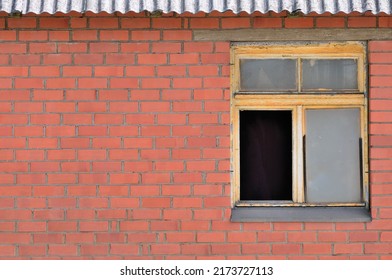 Old aged shed broken windows glass red bricks hut wall background grungy rusty dirty damaged wooden frame textured horizontal shack backdrop copy space closeup grunge roof pattern crime poverty theory