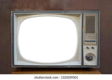 Old,  aged  television  on brown wall background, retro vintage tv style. empty white screen.  - Shutterstock ID 1325039501