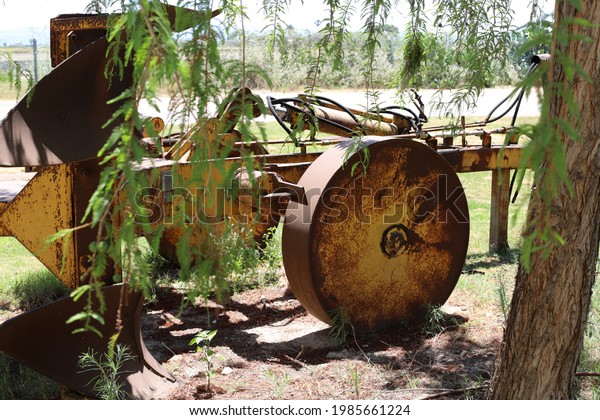 old agricultural\
machinery in the city park