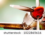 Old airplane turboprop engine with propeller blades, parts of wings and aircraft fuselage - concept closeup  historic vintage plane travel flight dramatic look retro style propeller plane aircraft