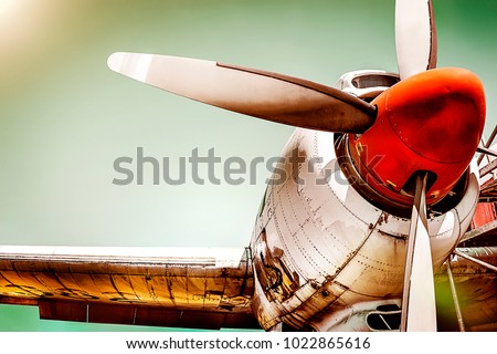 Old airplane turboprop engine with propeller blades, parts of wings and aircraft fuselage - concept closeup  historic vintage plane travel flight dramatic look retro style propeller plane aircraft