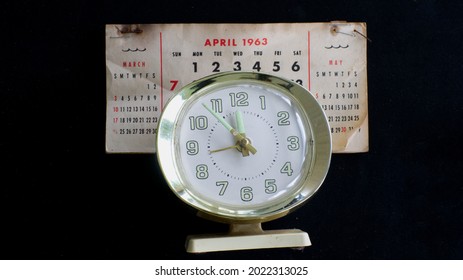 An Old Alarm Clock And Calendar