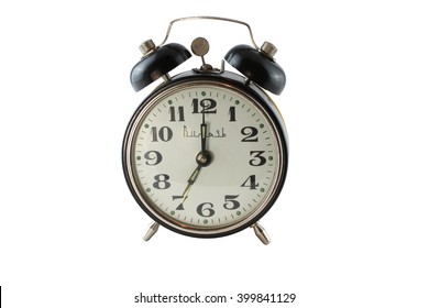 Old alarm clock of the times of the Soviet Union isolated on a white background. Closeup - Powered by Shutterstock