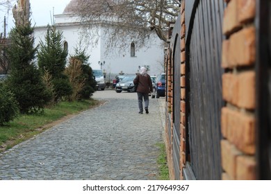 Old Albanian Woman Walking On Prizren Streets