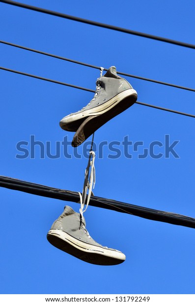 shoes on electric line
