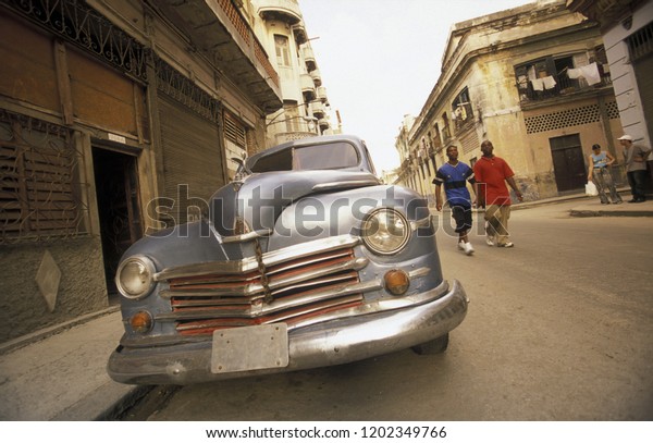 old\
american cars in the old town of the city of Havana on Cuba in the\
caribbean sea.    Cuba, Havana, September,\
2005