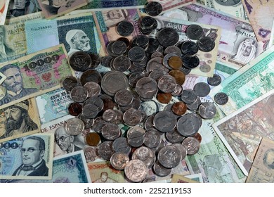 Old American coins of cents and dollars on various old cash money banknotes from different countries of the world, stack of multiple currencies, pile of vintage retro bills, ancient money - Powered by Shutterstock