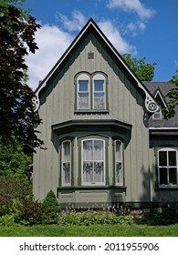 Old American Gothic Style House With Bay Window, Painted Pale Green