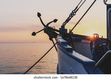 
old anchor on a fishing boat by the sea - Powered by Shutterstock