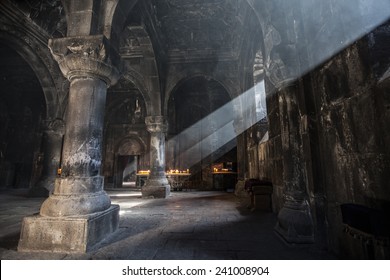 Old ancient Armenian christian church interior with amazing natural light. Geghard Monastery, 12 century