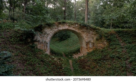 Old ancient medieval romantic brick bridge ruins at deep green forrest at summer day - Powered by Shutterstock