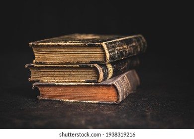 Old Antique Books On A Black Table.